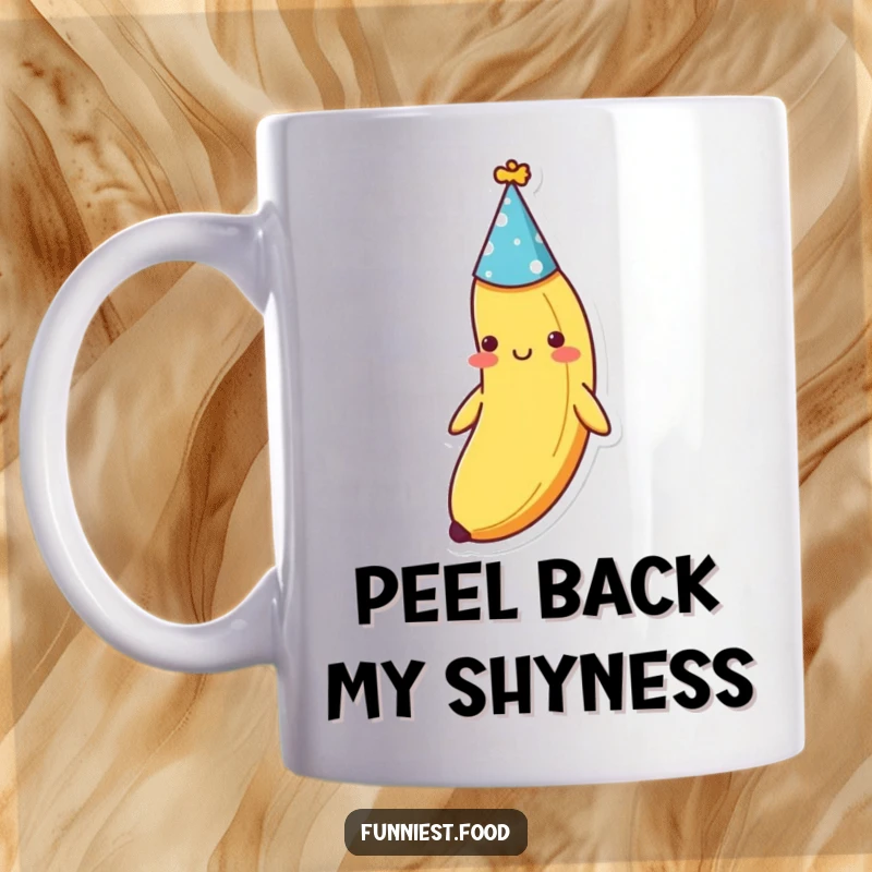 Funny shy banana wearing a tiny party hat, peeking out with a bashful smile on this ceramic mug, a sweet funny gift.