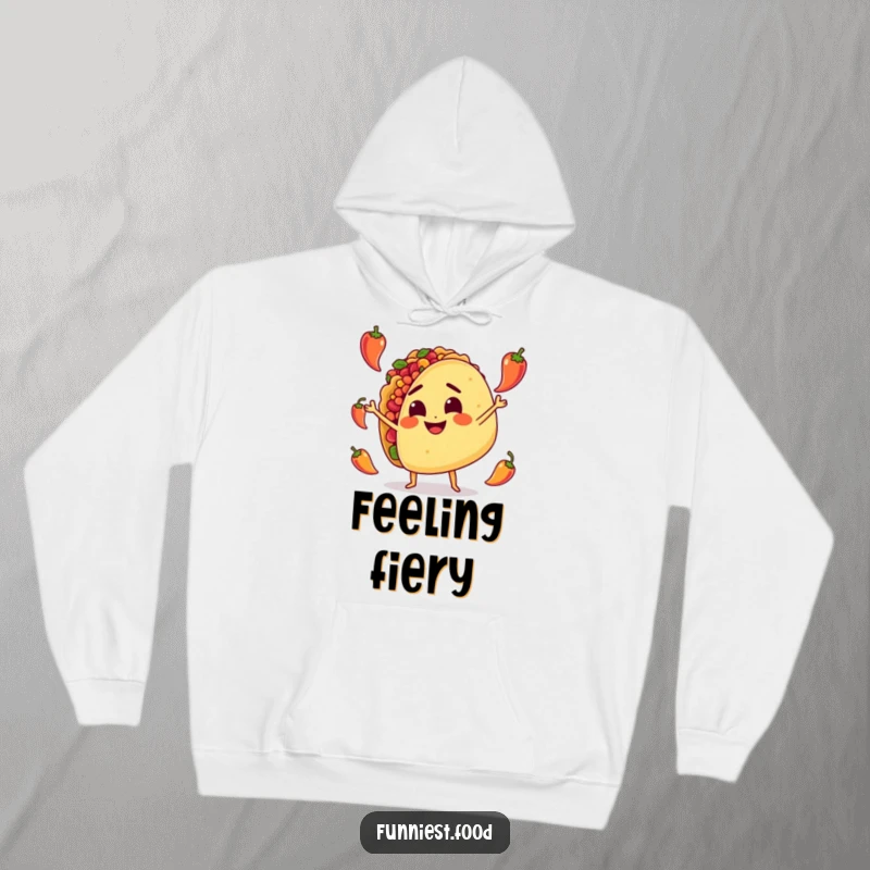 Funny Hoodie: A determined taco character enthusiastically juggles tiny peppers, radiating warmth and a spicy sense of humor.