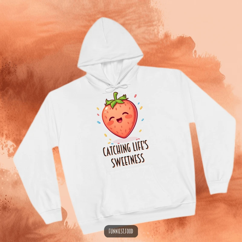 Funny Strawberry Hoodie: A warm hoodie featuring a joyful strawberry character trying to catch colorful falling sprinkles.