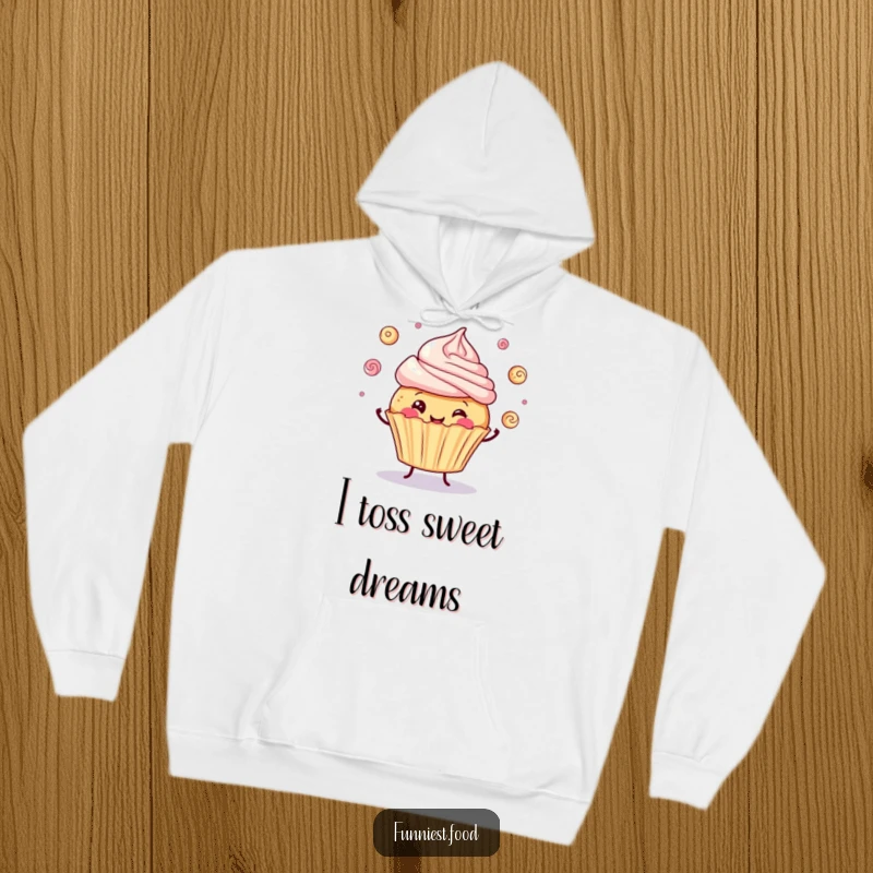 Funny hoodie featuring a happy cupcake juggling frosting swirls, offering comfort and a dash of sweet humor.