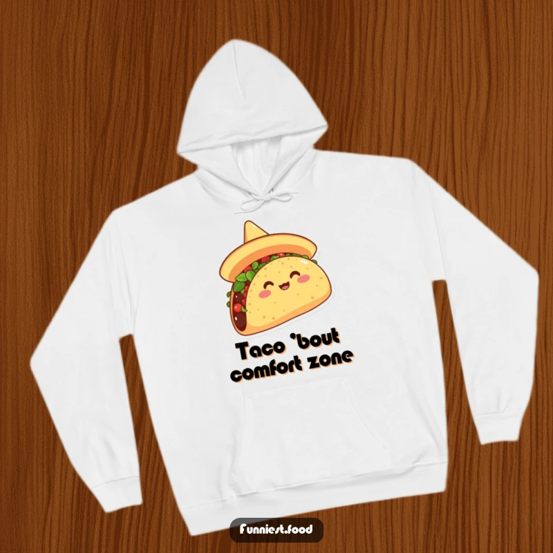 Funny hoodie showcasing an overjoyed taco in a sombrero, gleefully tipping it, a must-have for humorous, warm, and festive wear.