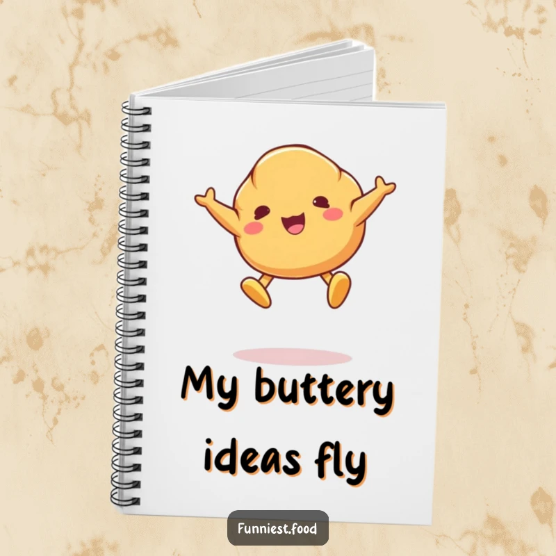 Funny notebook featuring a jumping croissant character with butter pat feet, ideal for capturing notes with a humorous touch.