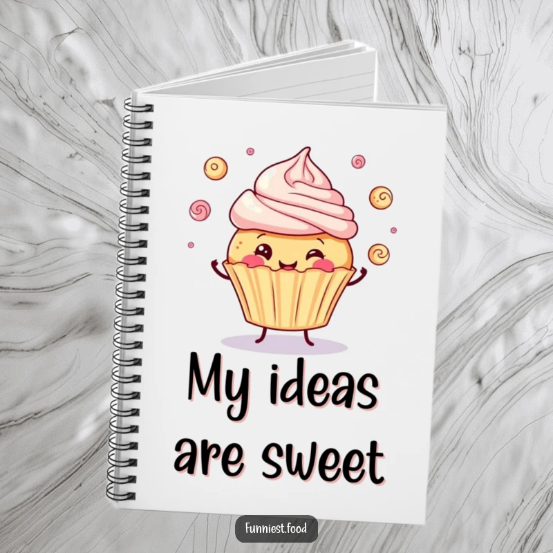 Funny notebook with a jolly cupcake juggling frosting swirls, perfect for jotting down notes with a side of humor.