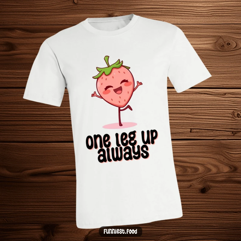 Funny grinning strawberry character balancing on one leg, winking on a t-shirt, a cheerful and humorous graphic.
